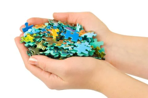 Hands and puzzle Stock Photos