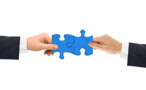 Hands and puzzle Stock Photos