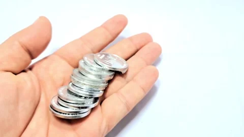 Hands and Silver Coins. Stock Footage 329908219