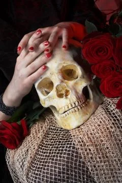 Hands and skull Stock Photos
