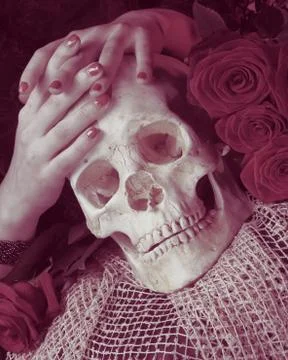 Hands and skull Stock Photos