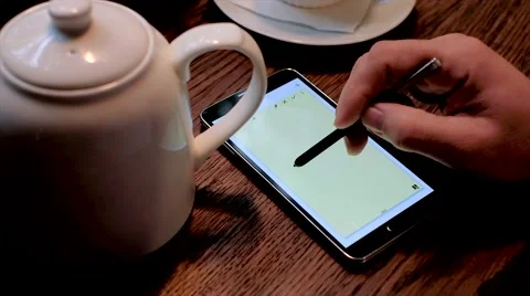 Hands and stylus using computer tablet. "Sale!" on screen Stock Footage 67455978