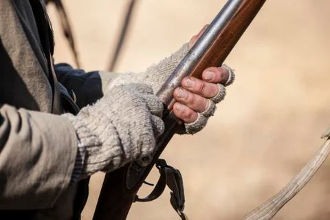 Hands and vintage muzzle loader Stock Photos