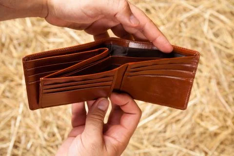 Hands and wallet Stock Photos