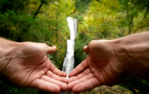 Hands and Waterfall Stock Photos