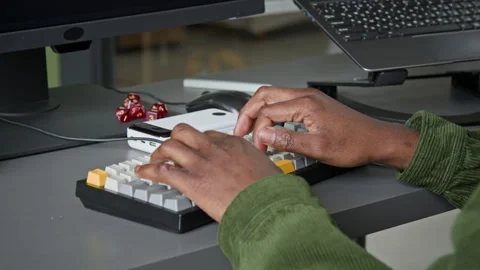 Hands of Anonymous Black Programmer Typing on Keyboard while Writing Code Stock Footage 335940068