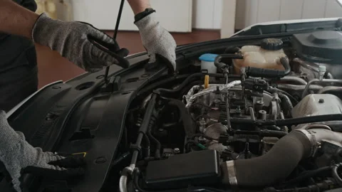 Hands of Anonymous Car Mechanics Discussing Reason for Engine Misfire Stock Footage 329406978