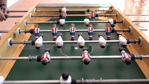 Hands of anonymous people playing table football 動画素材 140981940