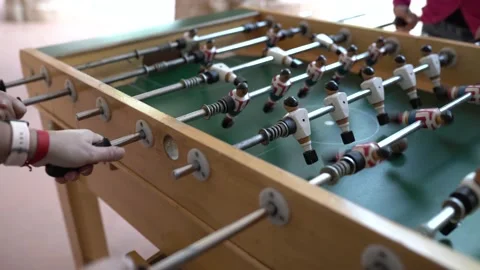 Hands of anonymous people playing table football 動画素材 140982446
