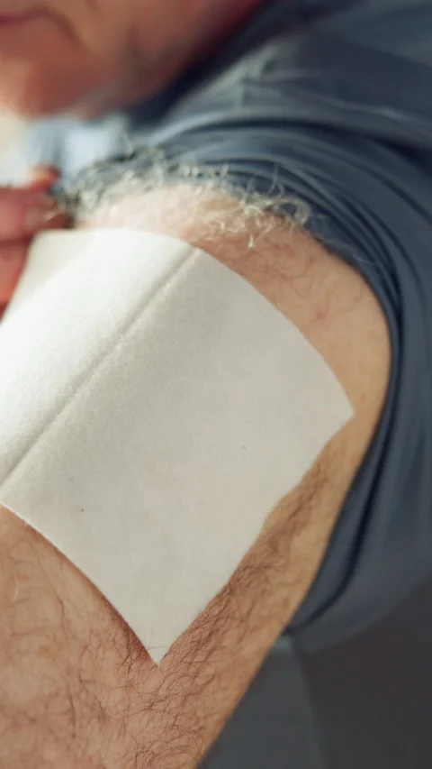 Hands, apply and relief patch on arm for pain management, adhesive or body care Vídeos de archivo 319865974