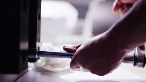 Hands Applying Blue Adhesive at Workshop Bench, Precision Repair, Close Up Shot Stock Footage 340335516