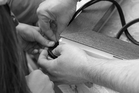 Hands applying strip. insulation of windows, door Stock Photos