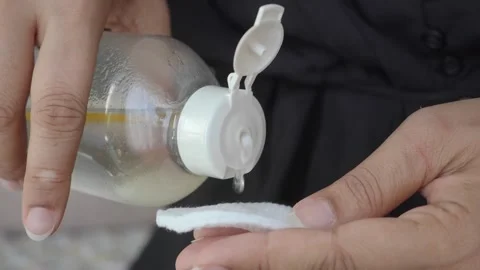 Hands Applying Toner With Cotton Pad For Gentle Skincare Cleansing And Makeup Stock Footage 342380897