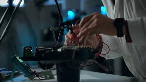 Hands-on approach in electronics assembly at a modern workspace Stock Footage 301404395