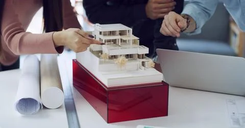 Hands, architect and building model at meeting, point and review with laptop Stock Photos