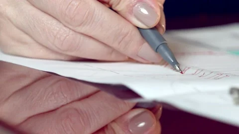 Hands of an architect and interior designer marking up project blueprints Stock Footage 226295085