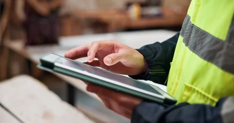 Hands, architect and scroll tablet at construction site for building Stock Footage 337987298