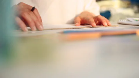 The hands of an architect draw using a pencil and a ruler at the desk. Stock Footage 138777027
