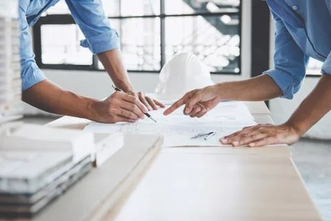 Hands of architect or engineer working on blueprint meeting for project worki Foto stock
