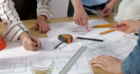 Hands of architects with construction project design drawings sketches.  Stock Footage 201740733