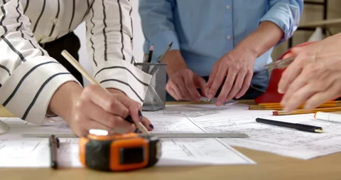 Hands of architects with construction project design drawings sketches.  Stock Footage 201742121