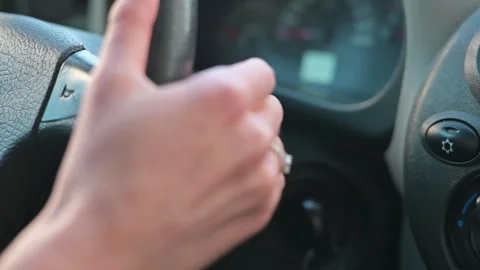Hands are actively steering and shifting gears in a car interior, highlighting Stockbeeldmateriaal 337642557