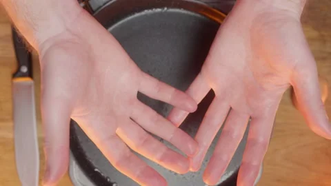 Hands are busy preparing ingredients meticulously for an enjoyable cooking Stock Footage 305593599