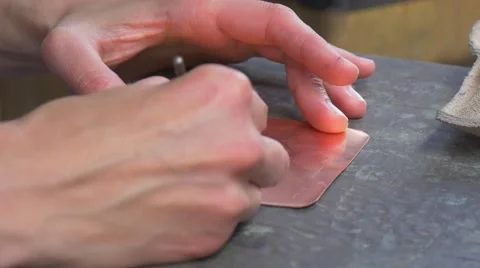 Hands Are Carving a Pattern on Metal Plate Show For Tourists Participants Are Stock Footage 64558394