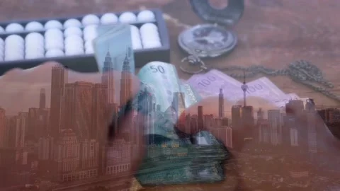 Hands are counting Ringgit Malaysia banknotes with view of Kuala Lumpur Stock Footage 142199196