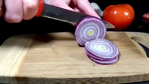 Hands are cutting a bow on a wooden board Video stock 80687320