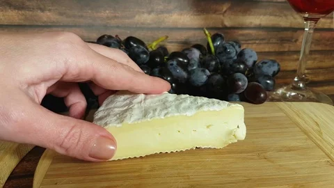 Hands are cutting cheese grapes Stock-Footage 82607766