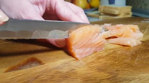 Hands are cutting red fish Stock Footage 83954821