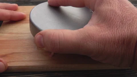 Hands are flipping a mold full of raw meat with onion pressed into burger cutlet Stock Footage 148873597