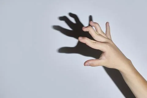 Hands are hooks with bent first phalanges of the fingers. 스톡 사진