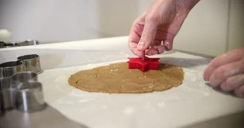 Hands are making gingerbread cookies for Christmas, 4k. Forming gingerbread Stock Footage 229702491