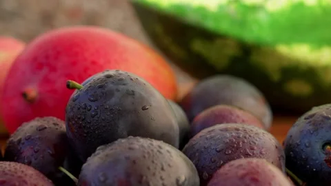 Hands are picking up a plum Stock Footage 321538013