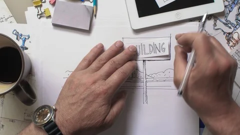 Hands are placed a piece of paper - building Vídeos de archivo 92443844