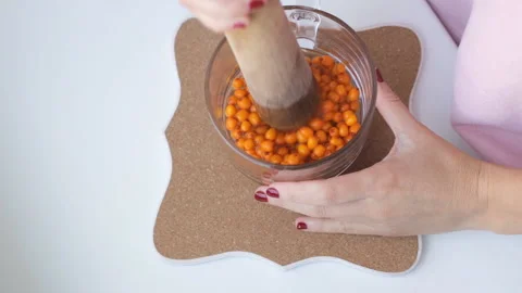 Hands are preparing tea buckthorn berries Stock Footage 96233603