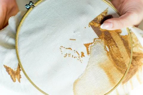 Hands are sewing with thread and needle Stock Photos