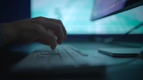 Hands are typing on a keyboard while a computer screen is displayed Video stock 292846195