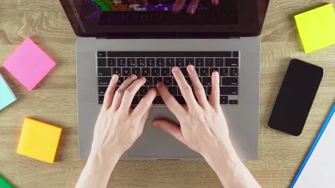 Hands are typing program code on the HTML programming language Stock Footage 203573615