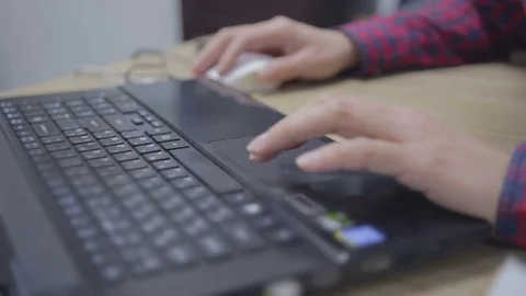 Hands are typing text on a laptop Stock Footage 69940815