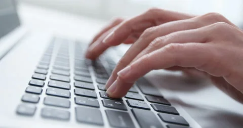 Hands are typing text on the laptop keyboard. Stock Footage 151669801