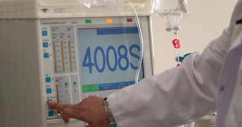 Hands are using  dialysis machine Stock Footage 86308648