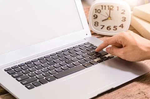 Hands are using a notebook computer. Stock Photos