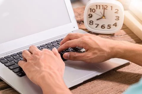 Hands are using a notebook computer. Stock Photos