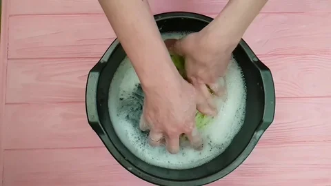 The hands are washed in the pelvis slow motion Stock Footage 89250994