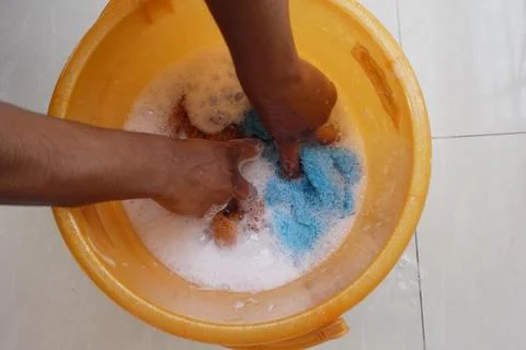 Hands are Washing Various Items in Soapy Water for Cleaning Purposes Stock Photos