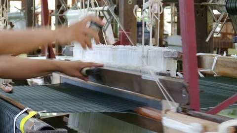 Hands are weaving silk Stock Footage 73098077