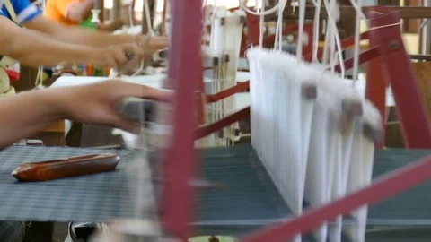 Hands are weaving silk Stock Footage 73103915